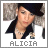 Static pixelated image of a person with dark hair wearing a black jacket over a light top, positioned against a blurred background with the name "ALICIA" displayed below in gray text.