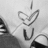A grayscale pixelated icon shows a heart shape above the letter U, with partial dark shapes on left and right edges.