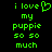 Green pixelated text on black background reads 'i love my puppy so so much' with a heart symbol replacing the letter O in 'love'.
