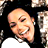 Static 48x48 pixel icon showing a close-up of a smiling person with dark hair against a black background, rendered in low-resolution pixel art style.