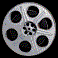 Silver film reel with eight black circular perforations and a central hub, displayed in three distinct rotational states against a black background.