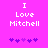 Pixelated text 'I Love Mitchell' in white on bright pink background with purple puzzle-piece symbols below, showing animation of puzzle pieces shifting left to right