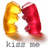 A static pixelated image shows two curved shapes resembling horns or crescents, one golden-yellow and the other deep red, positioned side-by-side with a white space between them. Below is gray text reading "Klutz" on the left and "mft" on the right.