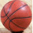 A red basketball with black lines and a white highlight on the left, next to pixelated text reading "I love Basketball" on the right.