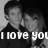 Black-and-white pixelated image of two people in close proximity with overlaid text reading 'I love you' at the bottom.