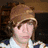 Two side-by-side figures with pixelated faces, one wearing a brown hat and white shirt, the other in a gray cap and dark clothing, both overlaid with red text boxes.