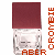 Two side-by-side pixelated images of a bottle with maroon cap and transparent body, each displaying text in vertical orientation.