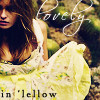 A woman with long brown hair wears a yellow floral dress, with text 'in 'lellow' at the bottom and 'love' in white script above her shoulder.