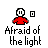 Pixel art character in red shirt with white head, showing multiple states including speech bubble 'Ah!!' and hand gestures, with text 'Afraid of the light' and 'Afraid of the dark' below.