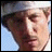 nine shows a man in a blue vest and white shirt holding a football, with vertical text reading 'Uncle Rico' on the right side