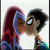 Two animated characters kiss, one with long red hair and blue clothing, the other with short black hair and a white shirt.
