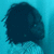 Dark blue silhouette of a rounded shape with pixelated edges against a gradient cyan background, appearing as an abstract or obscured figure.