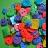 Pixelated static image with vibrant green, blue, red, and yellow hues forming abstract shapes against a multicolored background.