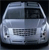 Static pixelated image of a silver sedan viewed from the front, with visible headlights, grille, and windshield against a dark background.