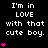 Black background with white text reading "I'm in LOVE with that cute boy." and pink heart symbols animating vertically.