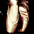 Two stylized, pixelated figures with smooth gradients and rounded shapes against a black background.