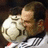 A man in a white sports jersey with black stripes holds a soccer ball against his face, with subtle variations in head position across frames.
