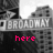 Black-and-white cityscape with 'BROADWAY' sign, pink text 'here', 'i', and 'come.' appearing sequentially over buildings.
