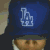 A contact sheet of five animated frames showing a person wearing a blue baseball cap with an LA logo, displaying different facial expressions and slight head movements across the sequence.