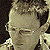 Six human figures arranged in two on a sepia-toned background with visible pixelation