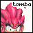 Pixelated character with bright pink spiky hair and white face, labeled 'tomba' above, surrounded by small red hearts on a light background.
