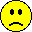 Five yellow pixelated smiley faces with black outlines and features on a gray background, each displaying variations in mouth shape or additional small details.