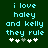 Pixelated cyan text on dark green background reads 'i love haley and kelly they rule' with five white plus signs below, one gray in the middle.