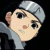 Pixelated cartoon character with light skin, large black eyes, and a small nose, wearing a light gray cap and shirt against a black background.