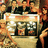 Pixelated image of a golden slot machine with three reels showing symbols, surrounded by blurred figures and red text reading "BD ROCKS" on the right.