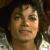 Pixelated close-up of a person's face with closed eyes, light skin tone, and dark hair against a blurred background.