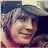 Pixelated image of a person with light brown hair wearing a dark cap, next to text reading "PATRICK" and "MARRY ME!" with pink heart symbols.
