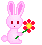 Pixel art contact sheet of seven pink bunny frames holding flowers with green Japanese text and red petals, arranged in a 3x3 grid on gray background.