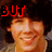 Four- of a person with dark curly hair wearing a light-colored shirt, with red text overlays reading 'BUT' and 'UGLY' in the top-left and bottom-left