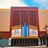 Static pixelated image of a building facade with vertical blue stripe and two white rectangular sections on a brown base.