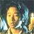 A 50x50 pixel animated contact sheet showing two frames of a character with light brown hair and yellow skin holding a candle, next to green text reading "Original Icons .com" on a dark background.