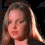 A woman with long light brown hair appears in three showing slight head movement and changing facial expressions against a dark background