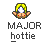 Pixelated character with yellow-green hair, blue eyes, and red cheeks holding a white cross-like symbol against gray background.