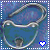 A pixelated blue icon with a silver chain loop and a small dark shape, featuring a white heart in the bottom right corner.