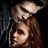Pixelated image of a person with long brown hair and light skin, wearing dark clothing against a black background.