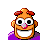 Pixelated cartoon character with orange skin, red hair, large black eyes, pink nose, and purple shirt against gray background.