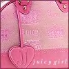 Pink Juicy Girl handbag with heart-shaped tag featuring 'J' logo, visible brand text, and metallic hardware details.