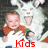 A child in a red and white shirt holds a white dog with its mouth open, while red text changes sequentially below.