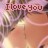 Pixelated image with text "I love you" overlaid on a blurred background of warm tones and indistinct shapes.