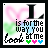 A square digital icon with pixelated text reading "I is for the way you look at me" and three small hearts below, set against a blurred pink and green background.