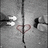 Black-and-white photo of hands forming a heart shape with fingers, surrounded by pink pixelated text asking if someone will break the heart or stay.
