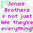 Pixelated text in bright pink and green on white background, repeating 'Jonas Brothers' with phrases below.