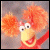 A pixelated animated contact sheet showing a Fraggle Rock character on the left and green text reading "Original Icons .com" on the right against a dark background.