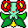 Pixel art character with light green face, red lips, white eyes, and large red flowers on head; green leafy body with yellow flower at base.