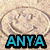 Pixelated image of a smiling face with light brown hair inside an oval shape, below which is blue text reading 'ANYA' on black background.
