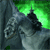 A gray stone gargoyle with a dark beak and eyes perched on a stone structure, set against a green glowing background.